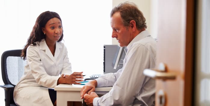 Female Doctor Treating Patient Suffering With Depression