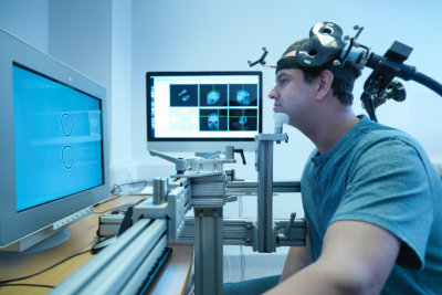 Patient in transcranial magnetic stimulation (TMS) experiment