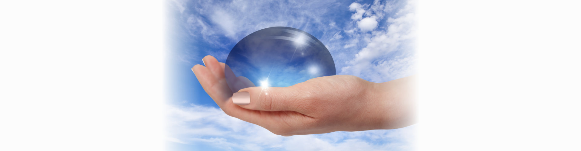 Crytal ball on a person's palm