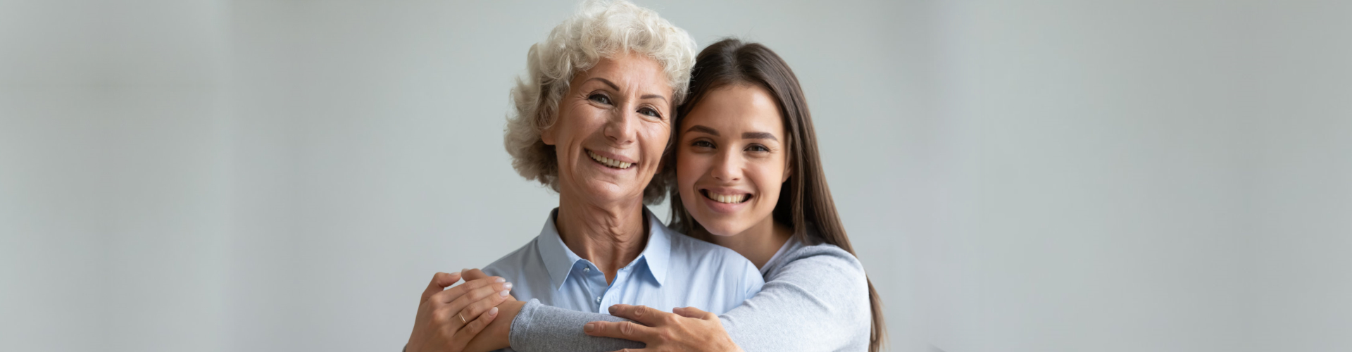 nurse hugging to senior woman