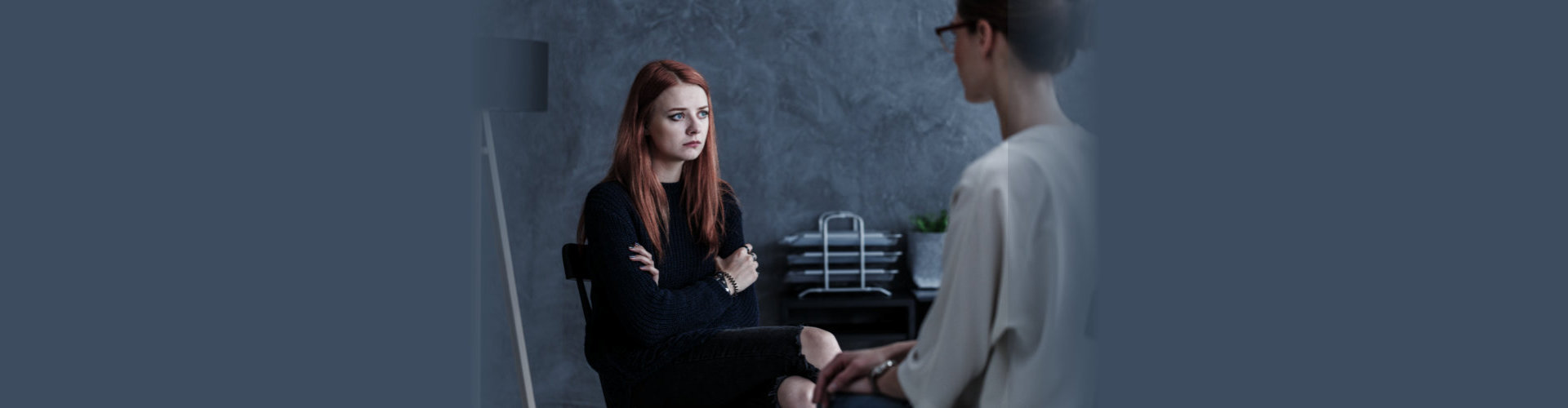 Rebellious teenager and counselor talking about problem with alcohol